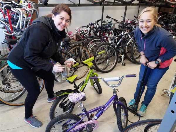 Volunteers get bikes ready for kids