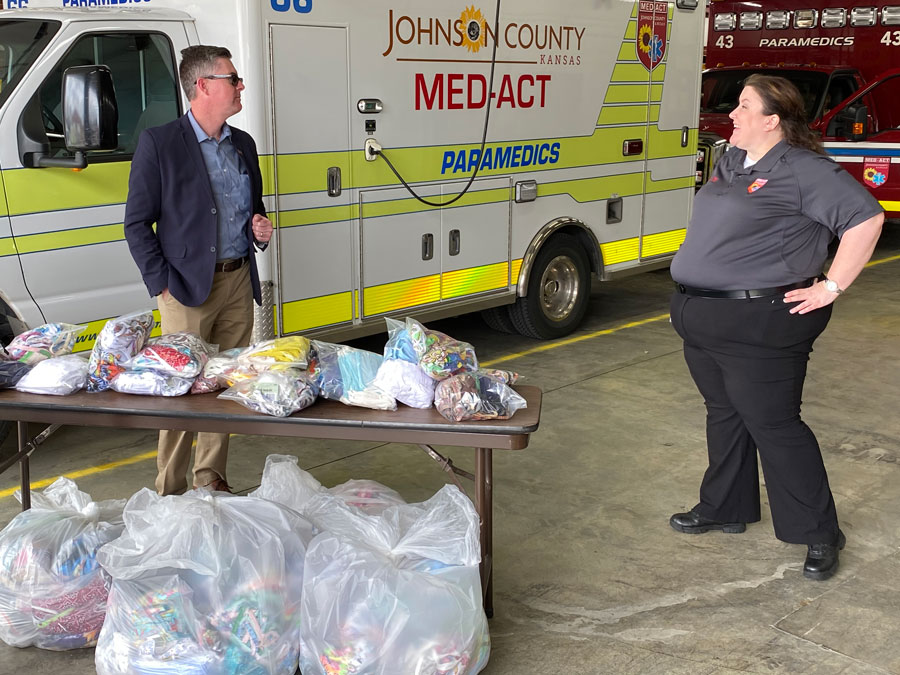 Josh Powers and Alyson Angel with donated masks in Johnson County.