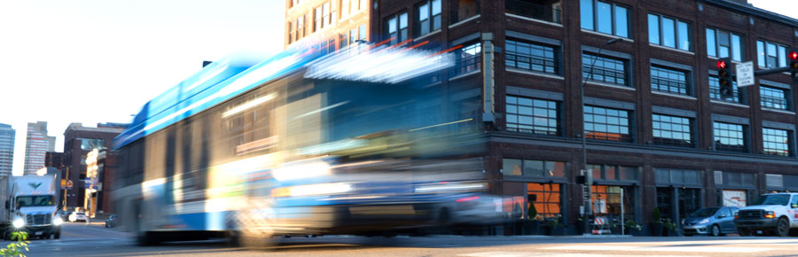 Bus in motion on city street